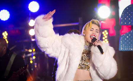 Singer Miley Cyrus performs during New Year's Eve celebrations at Times Square in New York, in this December 31, 2013, file photo. REUTERS/Carlo Allegri/Files