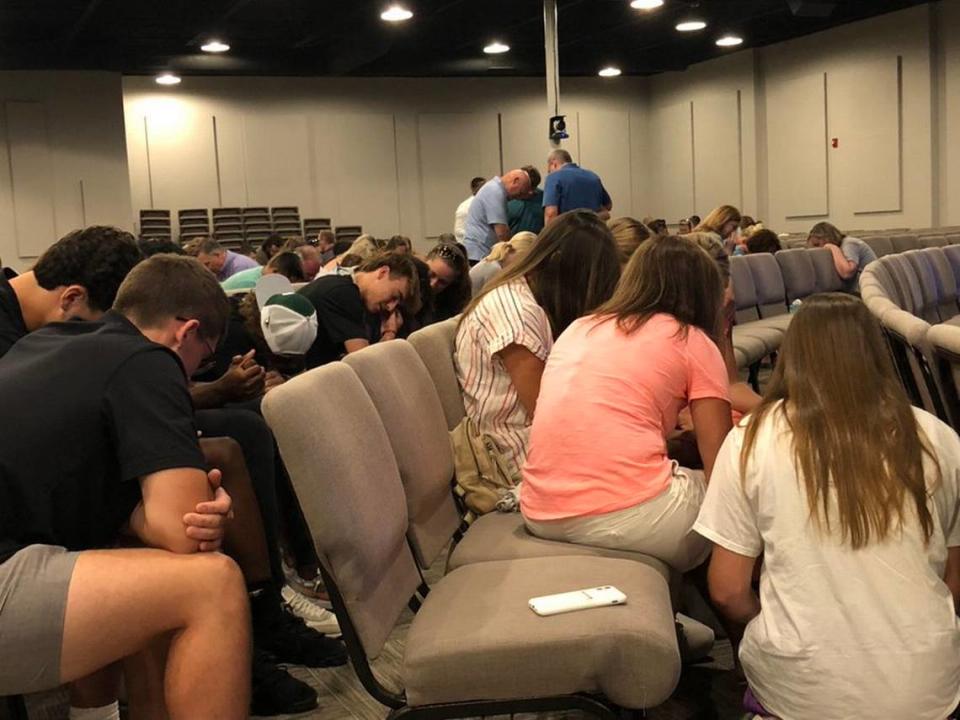 Members of the Lexington community pray for the recovery of the Smith family after they were injured in a car crash while on vacation in Hawaii.