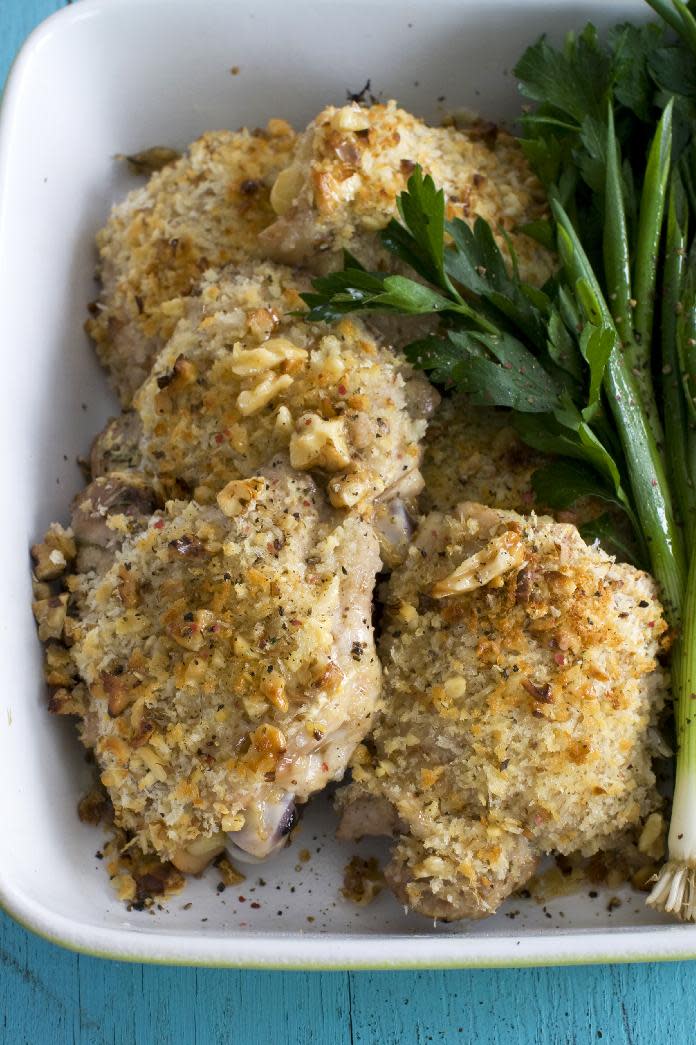 This March 18, 2013 photo taken in Concord, N.H. shows a recipe for herb-brined, walnut-crusted chicken thighs. (AP Photo/Matthew Mead)