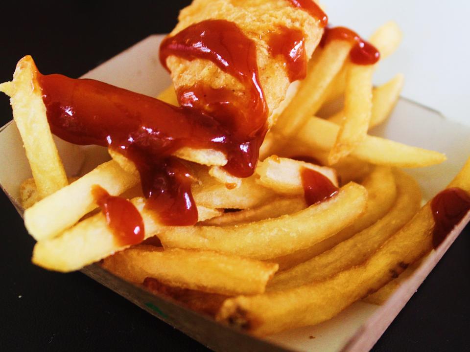 mcdonalds chicken nuggets and fries covered in bbq sauce