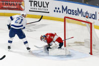 Tampa Bay Lightning defenseman Brayden Point (21) scores the go-ahead and eventual game-winning goal past Florida Panthers goaltender Sergei Bobrovsky (72) during the third period in Game 1 of an NHL hockey Stanley Cup first-round playoff series, Sunday, May 16, 2021, in Sunrise, Fla. (AP Photo/Joel Auerbach)