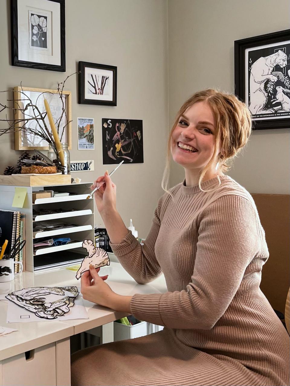 Artist Stacia Baldwin of Beastie + Bone in her home studio. Baldwin wants her work to help people understand that nature is worth protecting, not just for its own sake, but for the health of people.