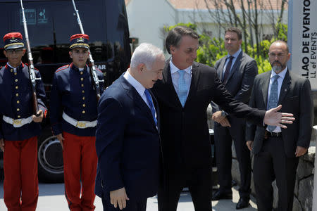 Israeli Prime Minister Benjamin Netanyahu is greeted by Brazil's President-elect Jair Bolsonaro before a lunch in Rio de Janeiro, Brazil December 28, 2018. Leo Correa/Pool via REUTERS