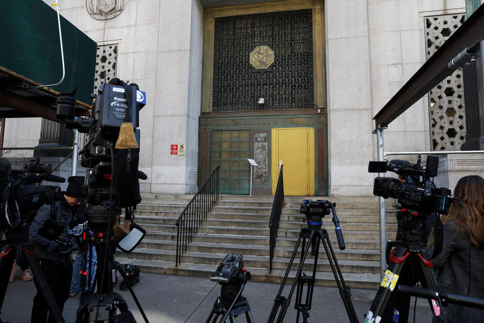 Members of the media set up outside 80 Centre Street in New York City, where Manhattan District Attorney Alvin Bragg continues his investigation into former US President Donald Trump, on March 20, 2023.