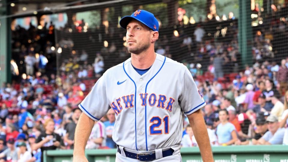 Jul 22, 2023; Boston, Massachusetts, USA; New York Mets starting pitcher Max Scherzer (21) walks onto the field before a game against the Boston Red Sox at Fenway Park. Mandatory Credit: Brian Fluharty-USA TODAY Sports