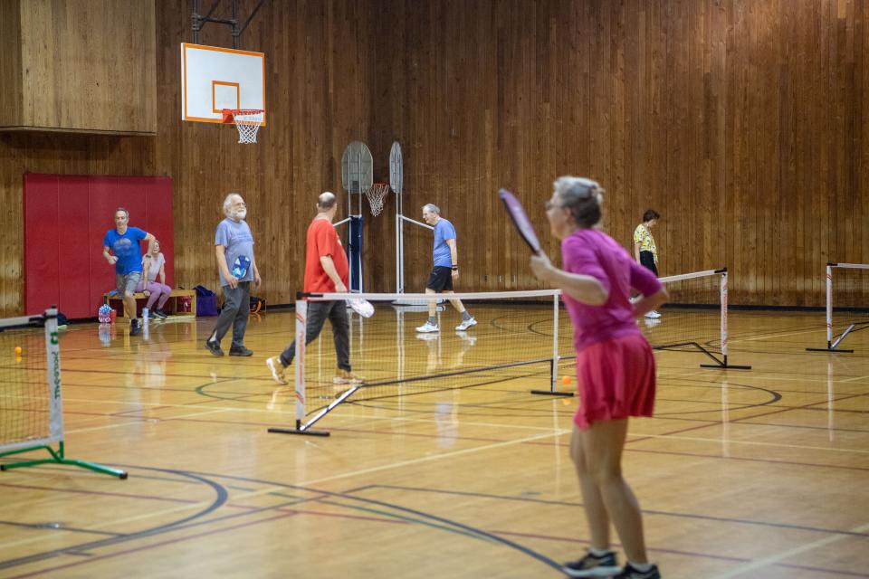 People play pickle ball at the YMCA in Asheville, March 29, 2024.