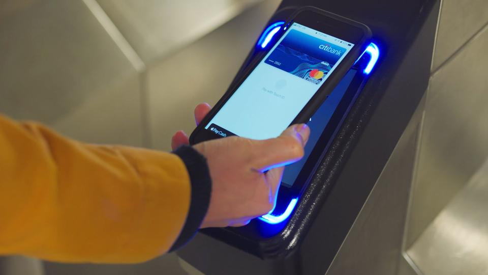 Mastercard demonstrates paying at a subway terminal.