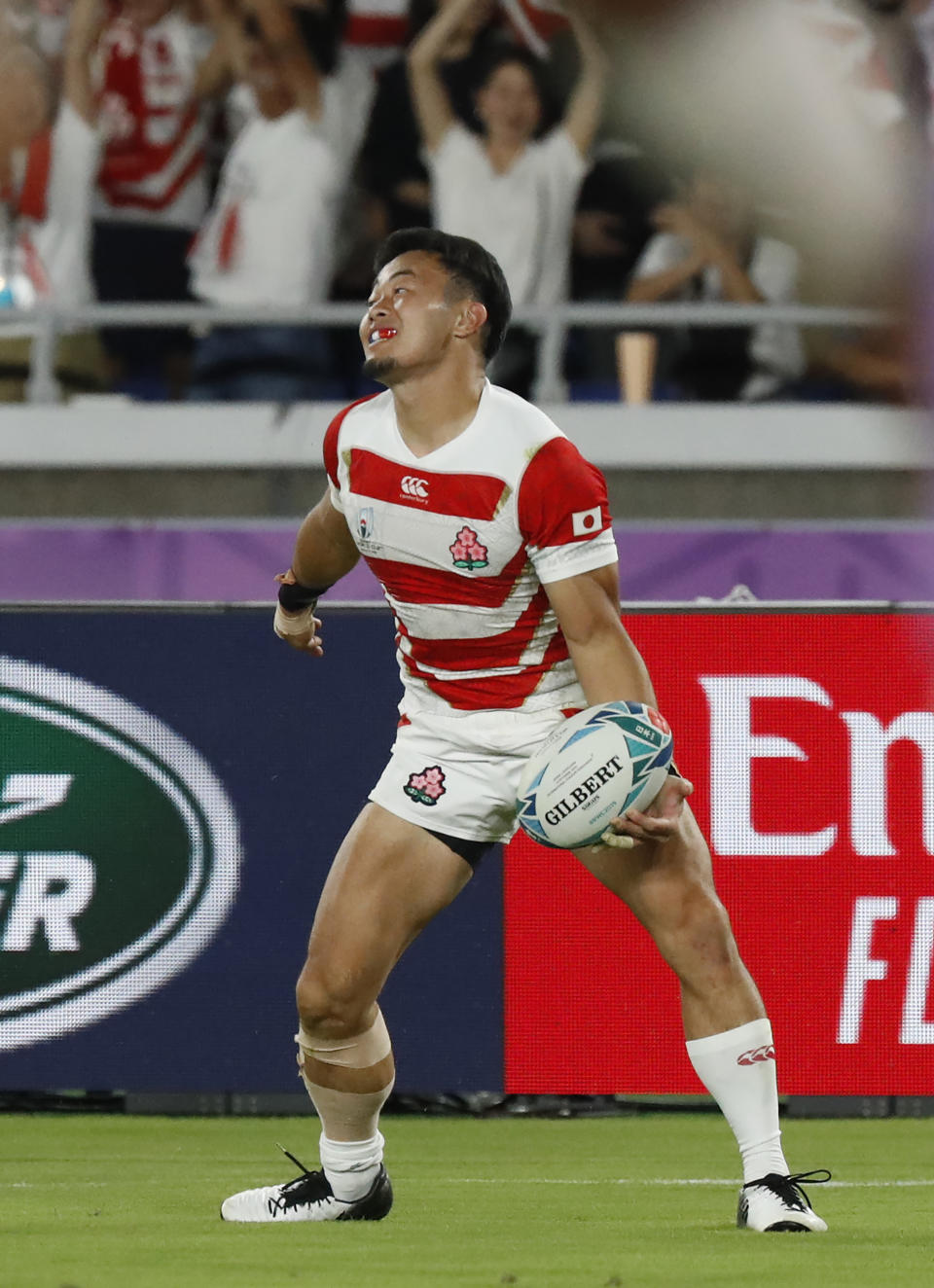 Japan's Kenki Fukuoka celebrates after scoring a try during the Rugby World Cup Pool A game at International Stadium between Japan and Scotland in Yokohama, Japan, Sunday, Oct. 13, 2019. (AP Photo/Eugene Hoshiko)