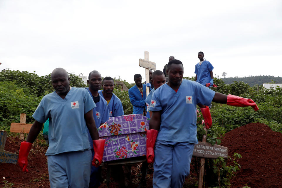 Red Cross workers carry the coffin of a woman who died of Ebola to be buried at a cemetery in the Eastern Congolese town of Butembo in the Democratic Republic of Congo, March 28, 2019