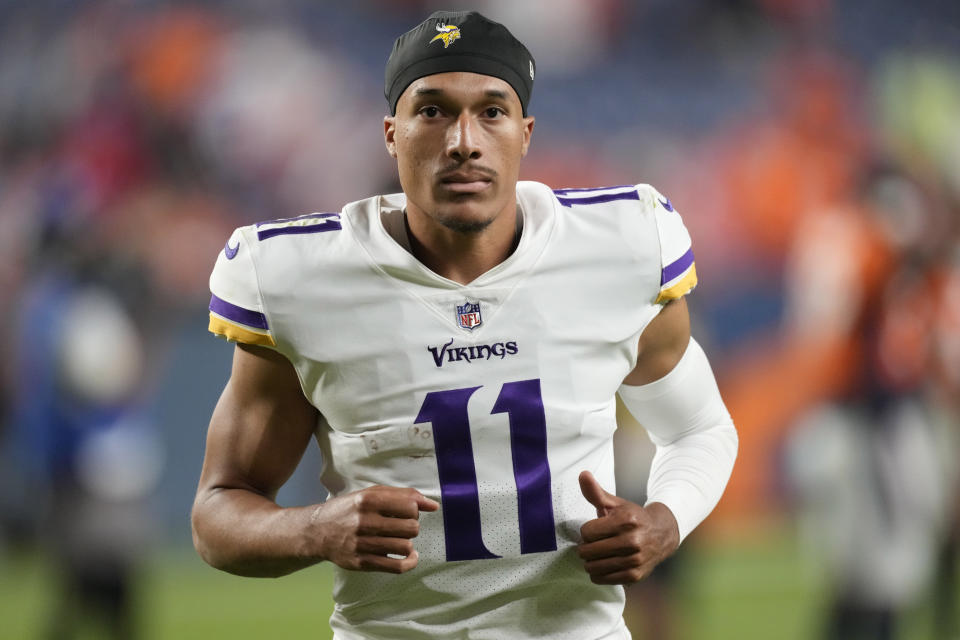 Minnesota Vikings quarterback Kellen Mond (11) leaves the field after an NFL preseason football game against the Denver Broncos, Saturday, Aug. 27, 2022, in Denver. The Broncos defeated the Vikings 23-13. (AP Photo/David Zalubowski)