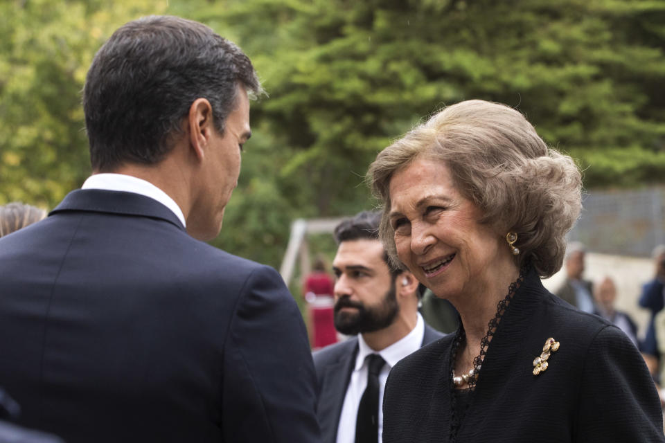 Queen Sofia of Spain shakes hands with Spain's Prime Minister Pedro Sanchez, left as they attend the funeral service for Montserrat Caballe in Barcelona, Spain, on Monday, Oct. 8, 2018. Caballe, a Spanish opera singer renowned for her bel canto technique and her interpretations of the roles of Rossini, Bellini and Donizetti, died on Saturday. She was 85. (AP Photo/Emilio Morenatti)