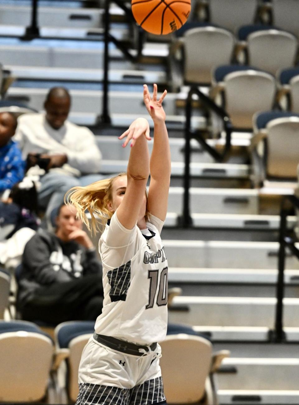 UNF guard Maddie Millar lets a 3-point attempt fly against Jacksonville University.