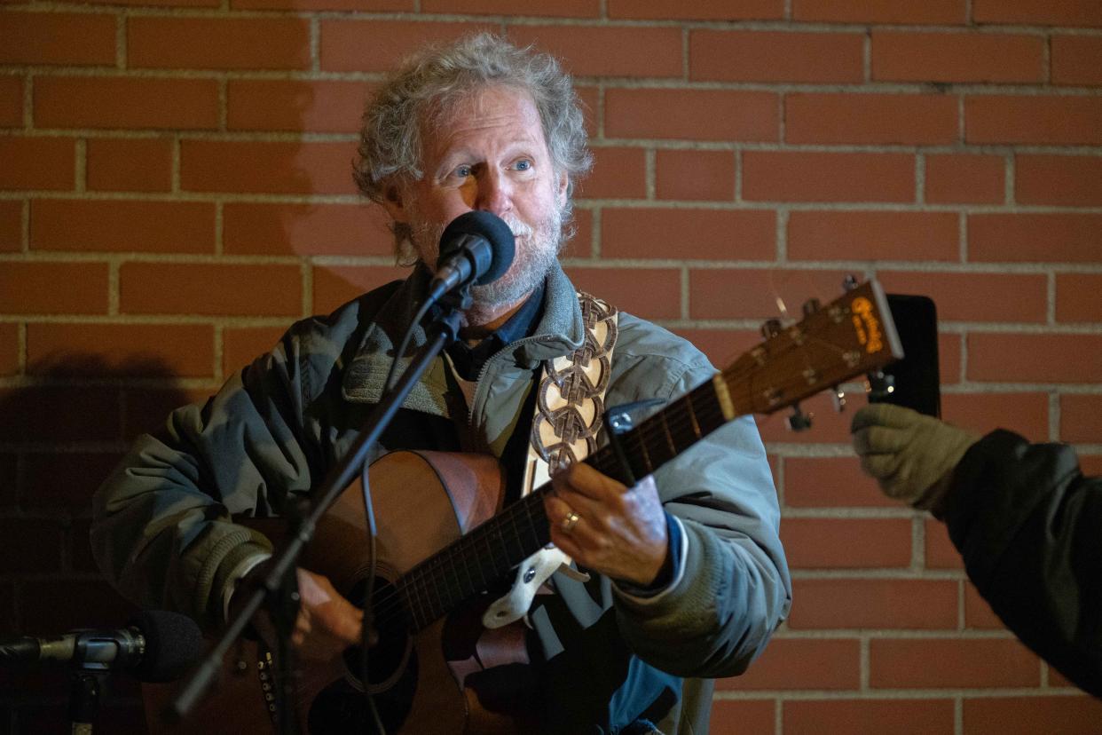 Local folk singer Bill Cohen's eclipse-inspired song imagines the April 8 celestial event as a catalyst for unity among people.