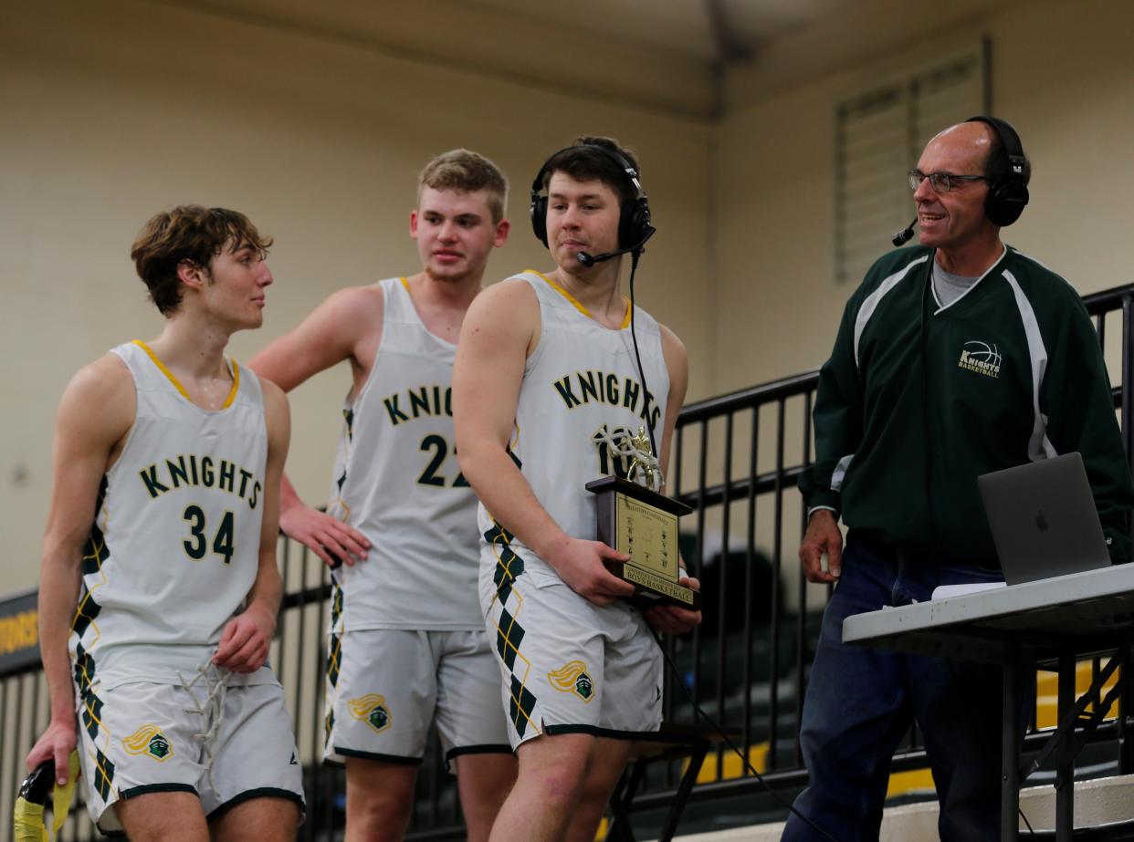 Northeastern seniors Ben Deitsch (right), Payton Lumpkin (center) and Raedhyn Foust (left) talk with the Northeastern podcast crew after claiming the Tri-Eastern Conference title Feb. 26, 2022.