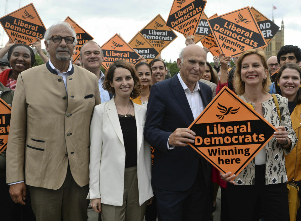 Liberal Democrats leader Sir Vince Cable, seocnd right, is joined by activists and the party's three new MEPs, from left, Dinesh Dhamija, Luisa Porritt and Irina von Wiese, as they celebrate the best ever European Election result in the party's history in central London, Monday, May 27, 2019. With results announced Monday for all regions in the U.K. except Northern Ireland, the Brexit Party had won 29 of the 73 British EU seats up for grabs and almost a third of the votes. On the pro-EU side, the Liberal Democrats took 20% of the vote and 16 seats _ a dramatic increase from the single seat in won in the last EU election in 2014. (Kirsty O'Connor/PA via AP)