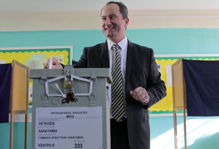 A handout picture released by the Cypriot Press and Information Office (PIO) shows presidential candidate for the Progressive Party of Working People (AKEL), Stavros Malas at a polling station during the first round of the presidential election on February 17, 2013 in Nicosia