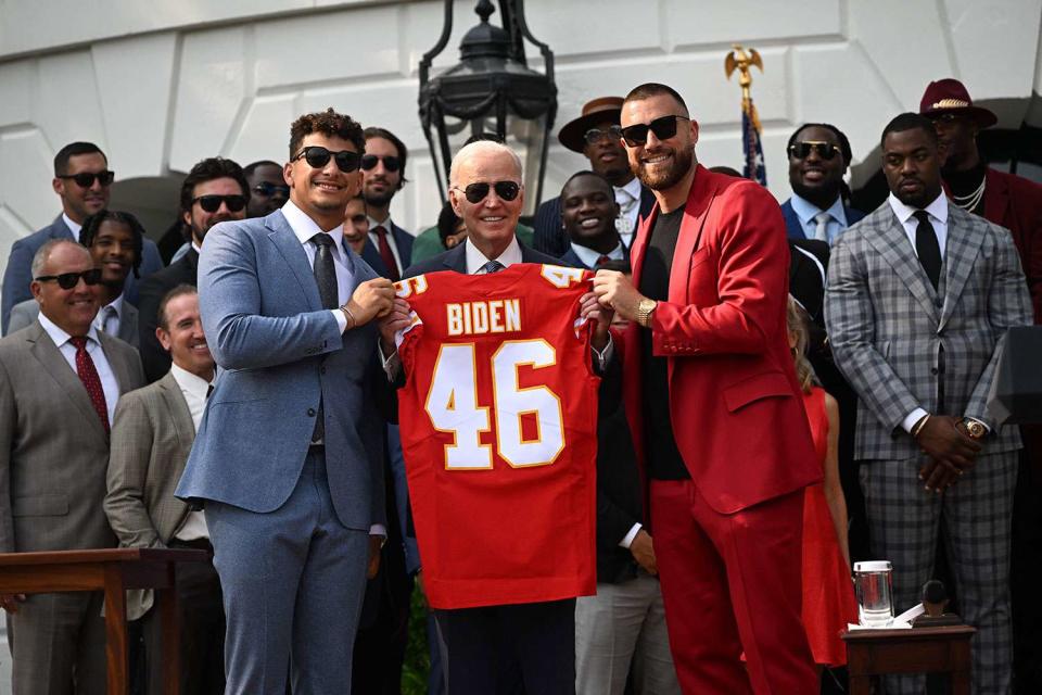 <p>ANDREW CABALLERO-REYNOLDS/AFP/Getty</p> From Left: Patrick Mahomes, President Joe Biden and Travis Kelce