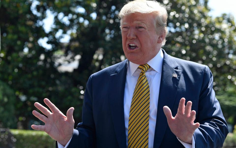 Donald Trump, speaking on the lawn of the White House on Saturday, said he was spending the weekend at Camp David discussing Iran with his aides - AP