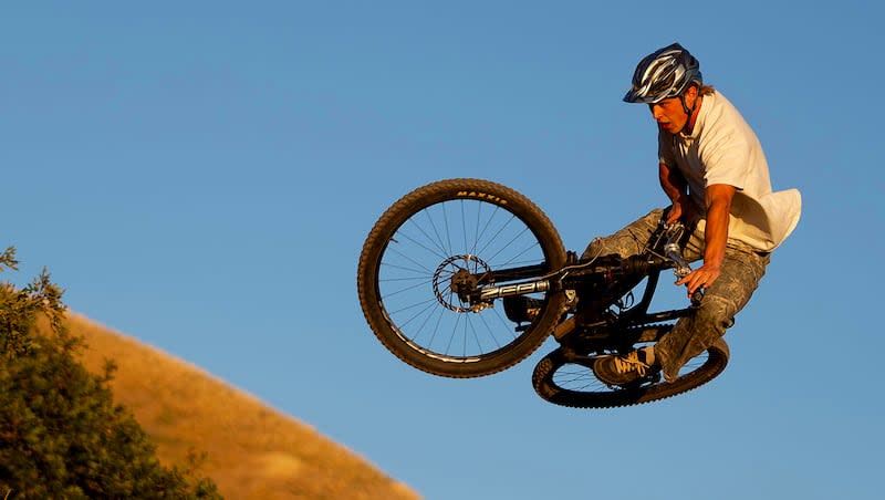 Kimball Peterson throws a tabletop at the I Street Bike Park in Salt Lake City on Wednesday, Sept. 18, 2024.