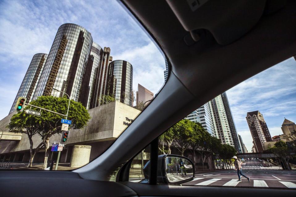 A view of the Westin Bonaventure Hotel & Suites' cylindrical glass towers from a car.