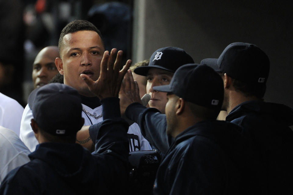 DETROIT, MI - OCTOBER 13: Miguel Cabrera #24 of the Detroit Tigers celebrates in the dugout after scoring in the sixth inning of Game Five of the American League Championship Series against the Detroit Tigers at Comerica Park on October 13, 2011 in Detroit, Michigan. (Photo by Harry How/Getty Images)