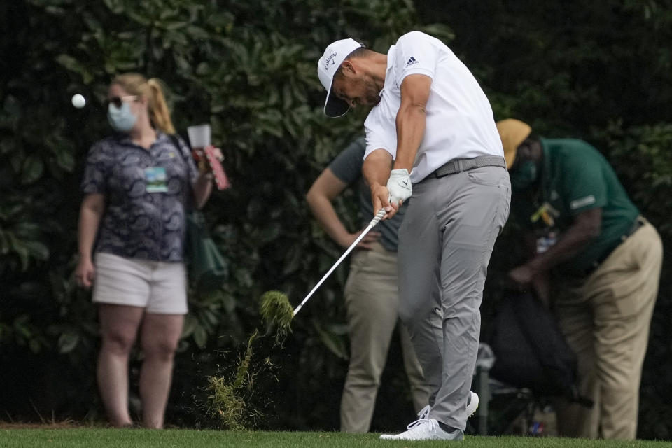 Xander Schauffele hits on the fifth hole during the final round of the Masters golf tournament on Sunday, April 11, 2021, in Augusta, Ga. (AP Photo/Gregory Bull)