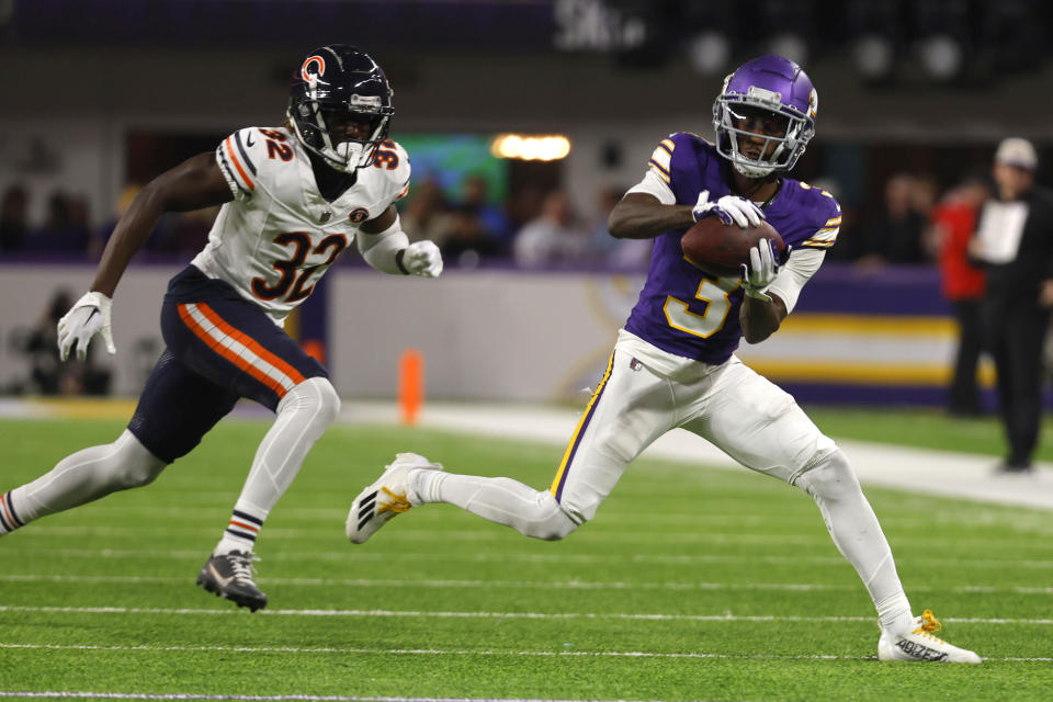 Minnesota Vikings wide receiver Jordan Addison (3) catches a pass in front of Chicago Bears cornerback Terell Smith (32) during the second half of an NFL football game, Monday, Nov. 27, 2023, in Minneapolis. (AP Photo/Bruce Kluckhohn)