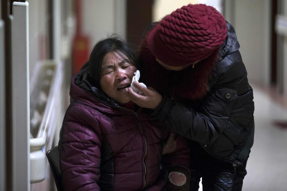 A woman cries at a hospital after a stampede occurred during a New Year's celebration on the Bund, central Shanghai January 1, 2015. The stampede killed at least 36 people, authorities said, possibly caused by people rushing to pick up fake money thrown from a building overlooking the city's famous Bund waterfront district. REUTERS/Aly Song (CHINA - Tags: DISASTER HEALTH SOCIETY)
