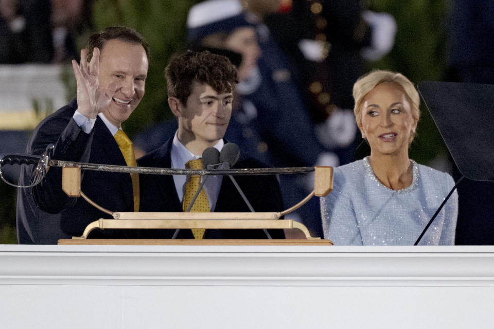 Louisiana Republican Gov. Jeff Landry, from left, smiles after being sworn for his inauguration ceremony next to his son J.T. Landry and wife Sharon Landry at the State Capitol building in Baton Rouge, La., Sunday, Jan. 7, 2024. The ceremony was moved because of forecasted rain on Monday, Jan. 8, the actual date Landry officially becomes governor. (AP Photo/Matthew Hinton)