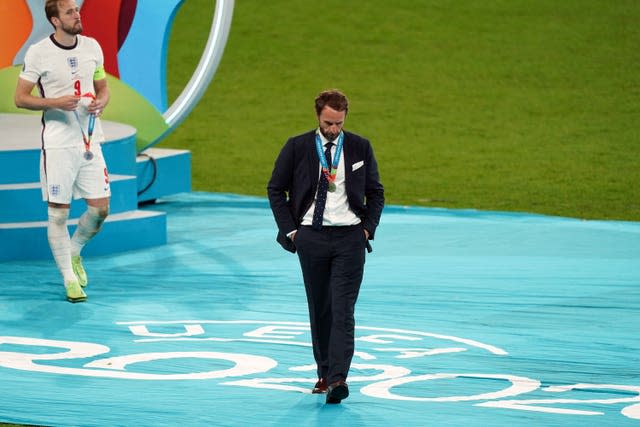 Gareth Southgate and Harry Kane, left, react after collecting their European Championship runners-up medals