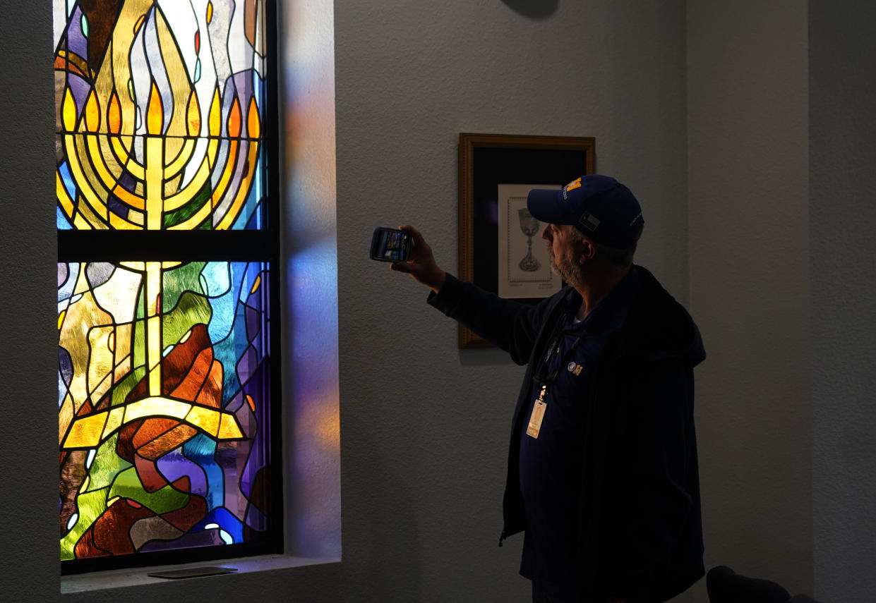 FILE - A stained glass window that once had bullet holes is now repaired at Congregation Beth Israel in Colleyville, Texas, Thursday, April 7, 2022. In January, four were taken hostage by a pistol-wielding man during a Shabbat service. (AP Photo/LM Otero, File)