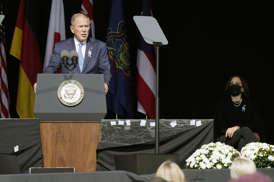 Former President George W. Bush speaks during a memorial for the passengers and crew of United Flight 93, Saturday Sept. 11, 2021, in Shanksville, Pa., on the 20th anniversary of the Sept. 11, 2001 attacks, as Vice President Kamala Harris looks on, right. (AP Photo/Jacquelyn Martin)