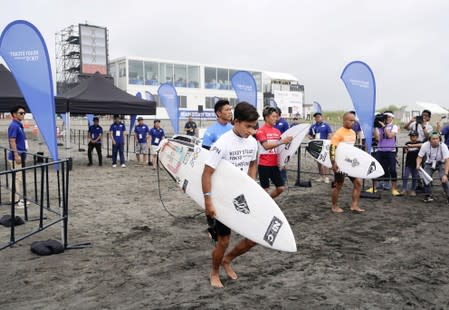 Competitors are seen during a Tokyo 2020 Olympics surfing test event at at Tsurigasaki-kaigan beach, also known as Shidashita beach in Ichinomiya Town, Japan