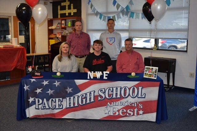 Pace's Tanner Sauls (middle, sitting) signed his letter of intent to play baseball at Northwest Florida State College.