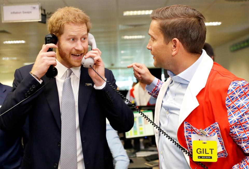 Prince Harry works on a trade during BGC Charity Day, honoring the victims of the September 11th attacks, on Wednesday in London.