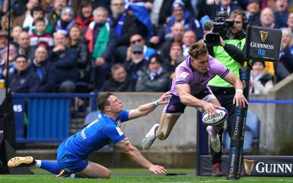 Scotland winger Duhan van der Merwe leaps and scores - Andrew Milligan/PA