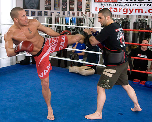 George St-Pierre, interim Ultimate Fighting Championship Welterweight Champion, spars with trainor Firas Zahabi during a training session Wednesday, March 26, 2008 in Montreal. St-Pierre will face Matt Serra April 19 in Montreal.