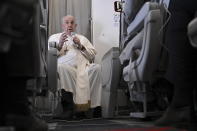 Pope Francis meets the journalists during an airborne press conference aboard the airplane directed to Rome, at the end of his pastoral visit to Congo and South Sudan, Sunday, Feb. 5, 2023. (Tiziana Fabi/Pool Photo Via AP)