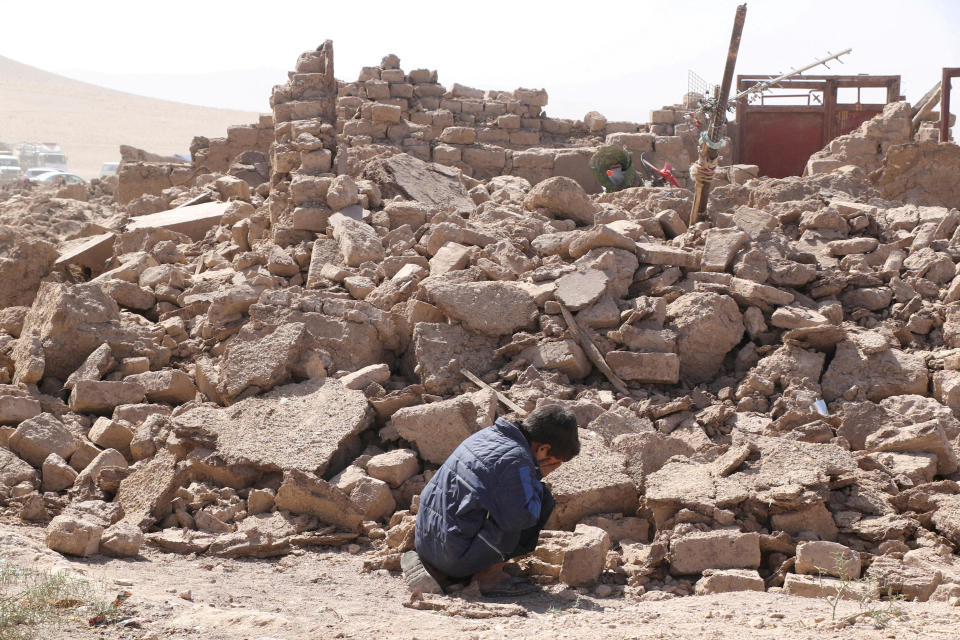 A boy cries as he sits next to debris in the aftermath of an earthquake in Zinda Jan, Afghanistan, Oct. 8, 2023. / Credit: Reuters/Stringer