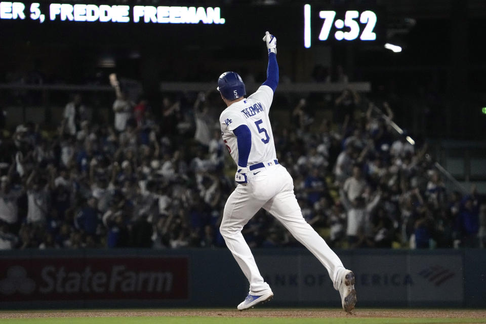 Los Angeles Dodgers' Freddie Freeman gestures before rounding third after hitting a two-run home run during the third inning of a baseball game against the San Diego Padres Tuesday, Sept. 12, 2023, in Los Angeles. (AP Photo/Mark J. Terrill)