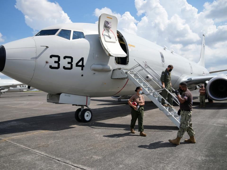 Admiral John C. Aquilino, commander of the U.S. Indo-Pacific Command (INDOPACOM), alights from a US P-8A Poseidon reconnaissance plane at Clark Air Base, Pampanga province, northern Philippines on March 20, 2022. (Aaron Favila/Associated Press - image credit)