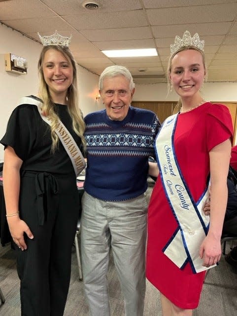 Pennsylvania Maple Queen Gracie Paulman (left) and Somerset County Fair Queen Kaylin Weaver (right) flank Dean Hillegas, one of the two remaining members of the Meyersdale Centennial committee, at Saturday evening's Sesquicentennial banquet, hosted by the BPOE Elks Lodge in Meyersdale. Charlie McKenzie is the other remaining member of the Centennial committee. At the banquet, the two queens, along with 2024 Maple King Jason Blocher, represented the two large events held in Meyersdale each year.