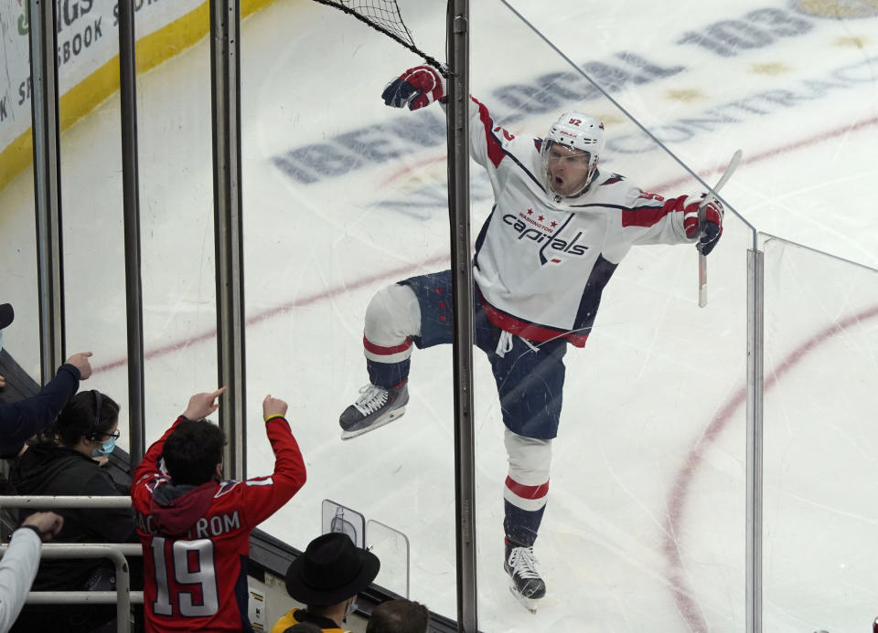 Washington Capitals center Evgeny Kuznetsov (92) reacts toward fans after scoring a goal during the first period of an NHL hockey game against the Boston Bruins, Thursday, Jan. 20, 2022, in Boston. (AP Photo/Mary Schwalm)