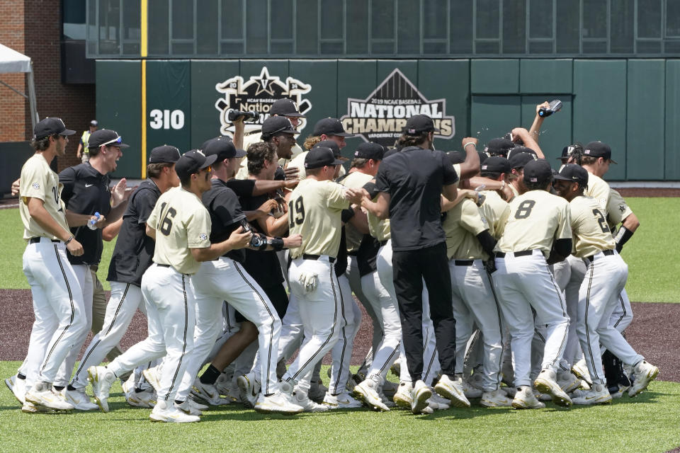 Vanderbilt players celebrate after beating East Carolina in an NCAA college baseball super regional game Saturday, June 12, 2021, in Nashville, Tenn. Vanderbilt won 4-1 to sweep the three-game series and advance to the College World Series. (AP Photo/Mark Humphrey)