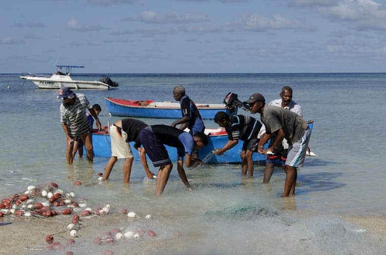 <span class="caption">Local fishermen offload their catch on Mahé island, Seychelles.</span> <span class="attribution"><a class="link " href="https://www.shutterstock.com/image-photo/mahe-island-seychelles15th-december-local-fisherman-177878093" rel="nofollow noopener" target="_blank" data-ylk="slk:Jerome Stubbs/Shutterstock;elm:context_link;itc:0;sec:content-canvas">Jerome Stubbs/Shutterstock</a></span>