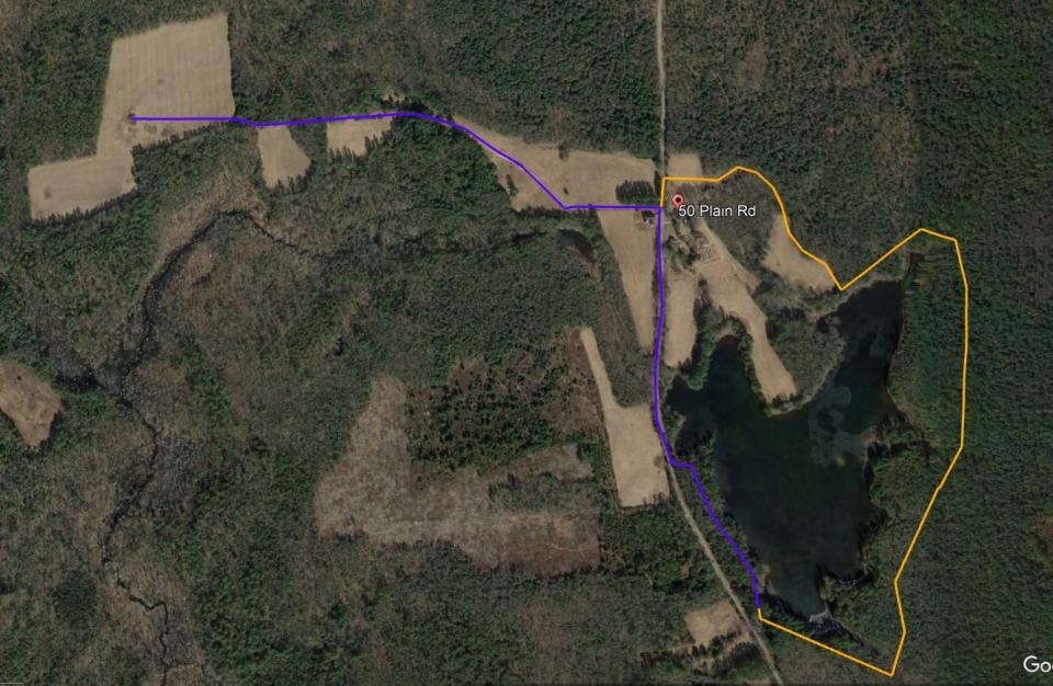 An aerial view of the trail circling Tillinghast Pond.