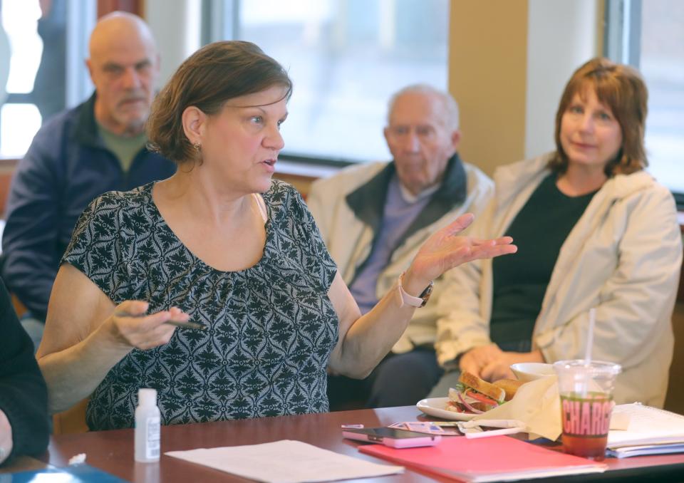 Cathy Soles conducts a meeting last month to gather signatures for a ballot initiative to change the way Summit County Animal Control operates.