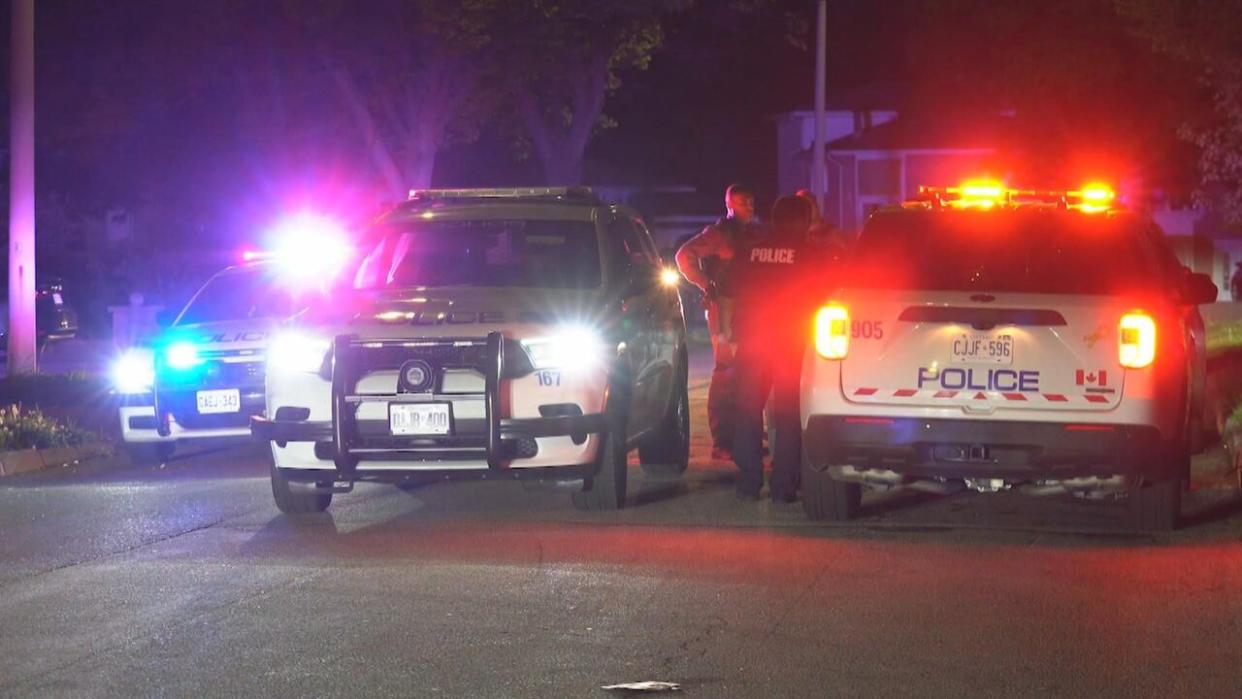 A man has been charged with three counts of attempted murder after three people were stabbed in the area of Wolfedale Road and Forestwood Drive on Friday, Peel police said.  (Arlyn McAdorey/CBC - image credit)