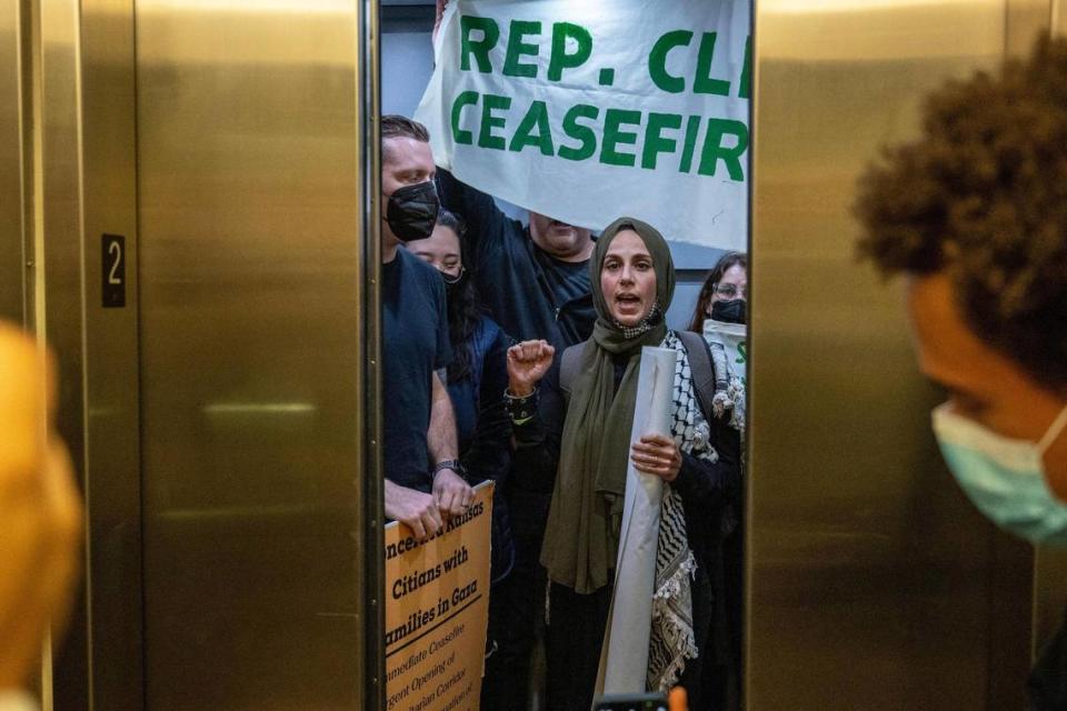 Fatima Mohammadi, member of Al-Hadaf KC, raised a fist while conducting a sit-in outside Rep. Emanuel Cleaver’s Kansas City office on Wednesday, Nov. 8, 2023. Organizers had coordinated the sit-in at Cleaver’s district office to advocate for his support of a cease-fire action and to express solidarity with the people of Palestine.