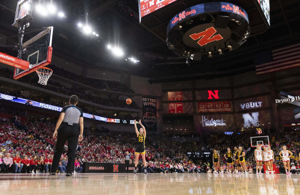 Iowa's Caitlin Clark (22) takes a free throw after a technical foul was called on the Nebraska bench during the second half of an NCAA college basketball game Sunday, Feb. 11, 2024, in Lincoln, Neb. (AP Photo/Rebecca S. Gratz)